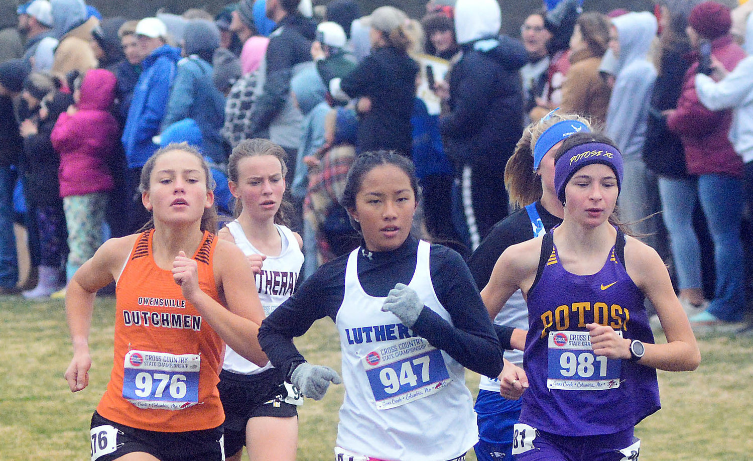 Ilene Limberg (left) races with a group of runners towards the front of the field during the Class 3 Girls Race at the Missouri State High School Activities Association (MSHSAA) Cross Country Championship Saturday in Columbia.